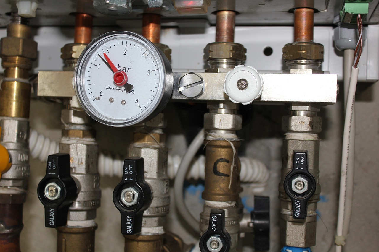 Pressure gauge and shut-off valves on a heating unit